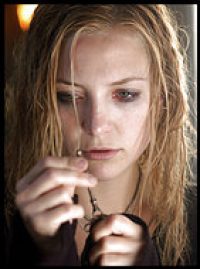 Kate Hudson discovers a skeleton key at the house of the stroke-victim she is caring for in the film The Skeleton Key